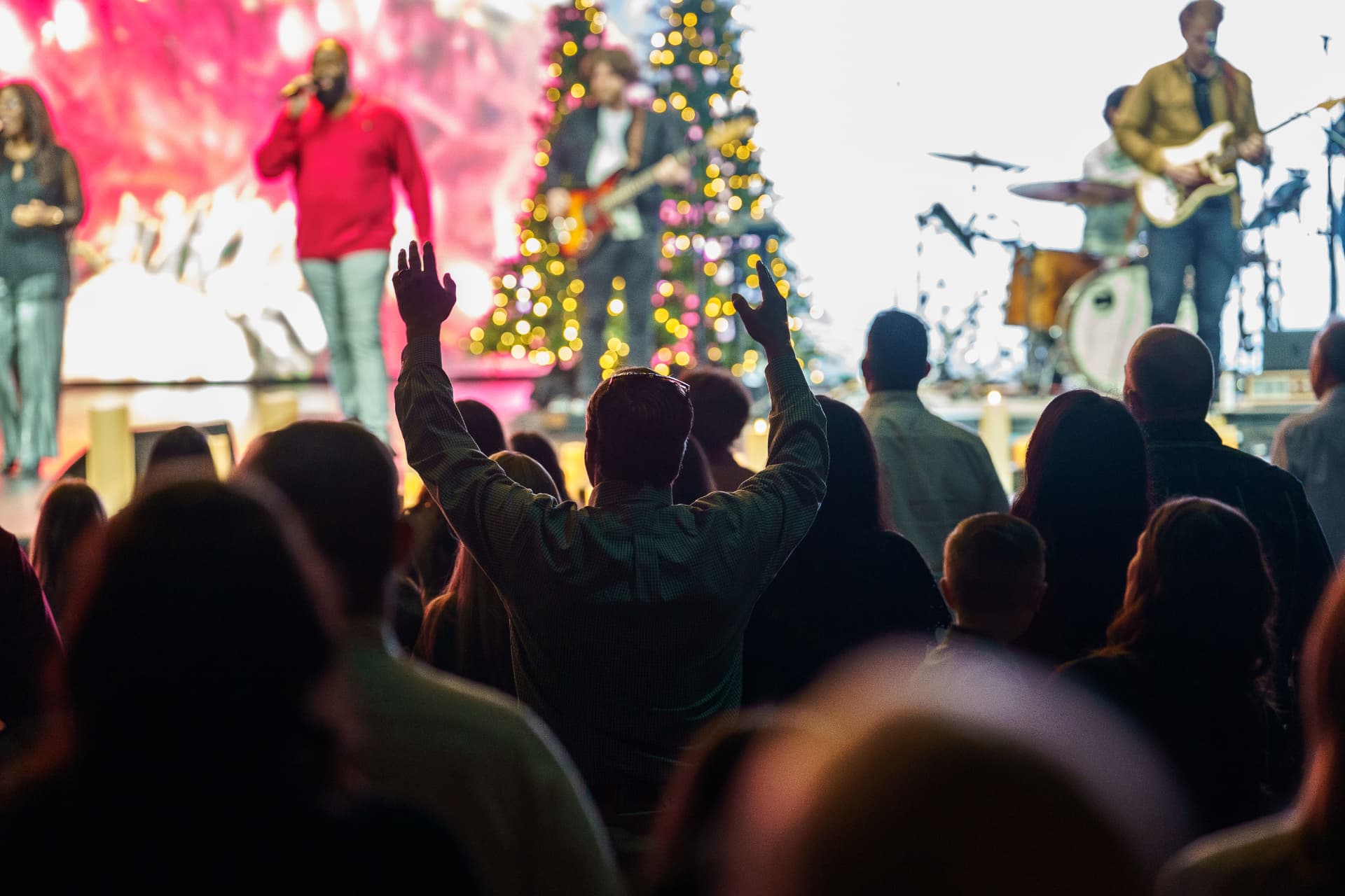 The congregation celebrating with the worship band